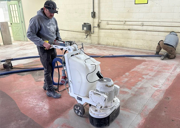 Diamond grinding concrete floor preparation before epoxy coating installation in Rockford IL